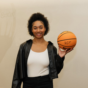 Hannah Stuelke Holding Autographed Basketball